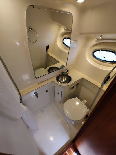 St Mary Yacht Photos Pics 2008 Tiara Yachts 3200 Open bathroom with sink, toilet, and mirror.