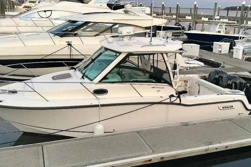  Yacht Photos Pics 2016 Boston Whaler 285 Conquest boat docked at marina.
