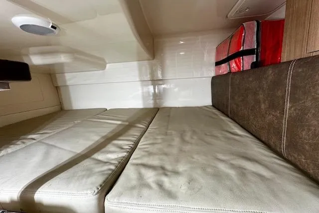  Yacht Photos Pics Interior cabin of 2016 Boston Whaler 285 Conquest with cushioned seating and storage.