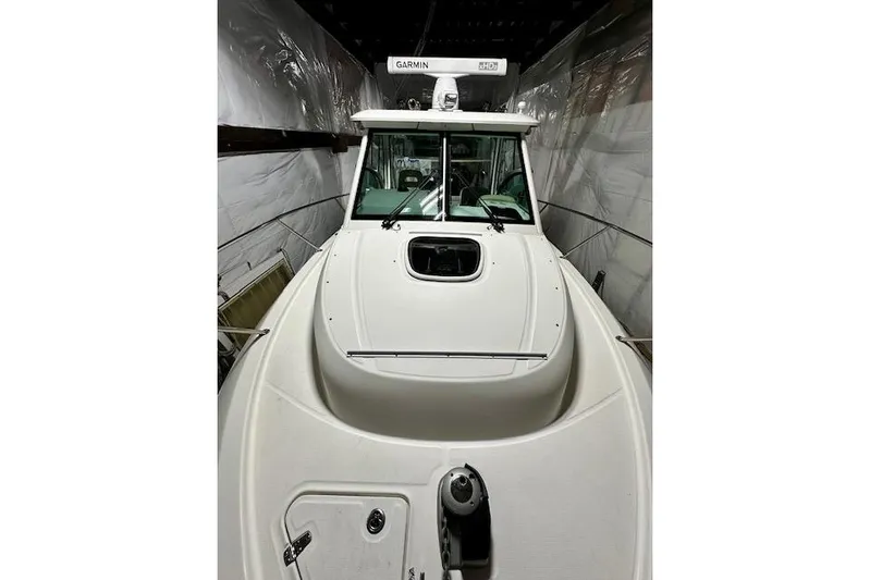  Yacht Photos Pics 2016 Boston Whaler 285 Conquest boat in storage, featuring Garmin equipment.