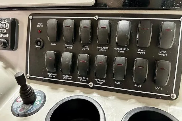  Yacht Photos Pics Control panel of a 2016 Boston Whaler 285 Conquest boat with labeled switches.