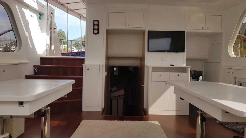  Yacht Photos Pics Interior of a 2017 Custom GULET yacht with modern furnishings and wooden flooring.
