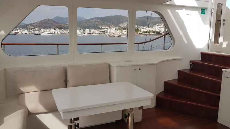  Yacht Photos Pics Interior of 2017 Custom GULET yacht with seating, table, and scenic ocean view.
