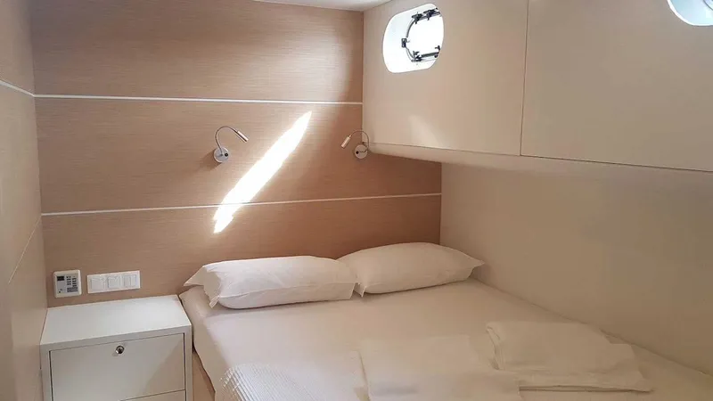  Yacht Photos Pics Cozy cabin interior on 2017 Custom GULET yacht with bed and porthole.