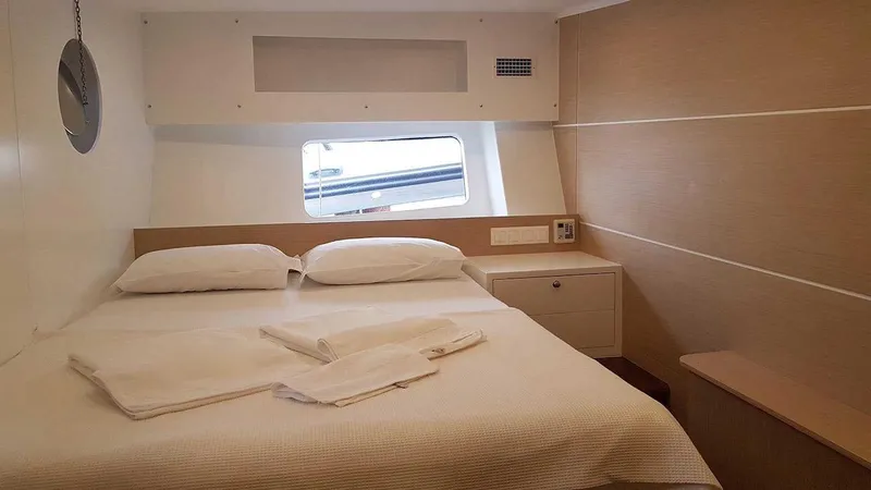  Yacht Photos Pics Cozy cabin interior on 2017 Custom GULET yacht with bed and window view.