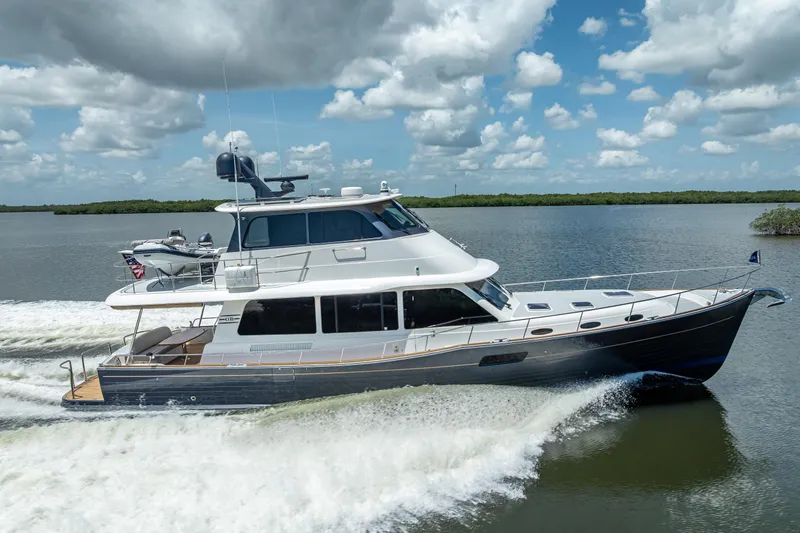 Escape Yacht Photos Pics 2022 Grand Banks GB60 Skylounge yacht cruising on a sunny day.