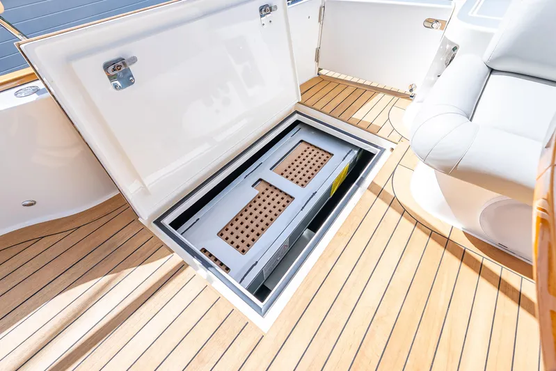 Escape Yacht Photos Pics 2022 Grand Banks GB60 Skylounge yacht with open deck storage compartment.