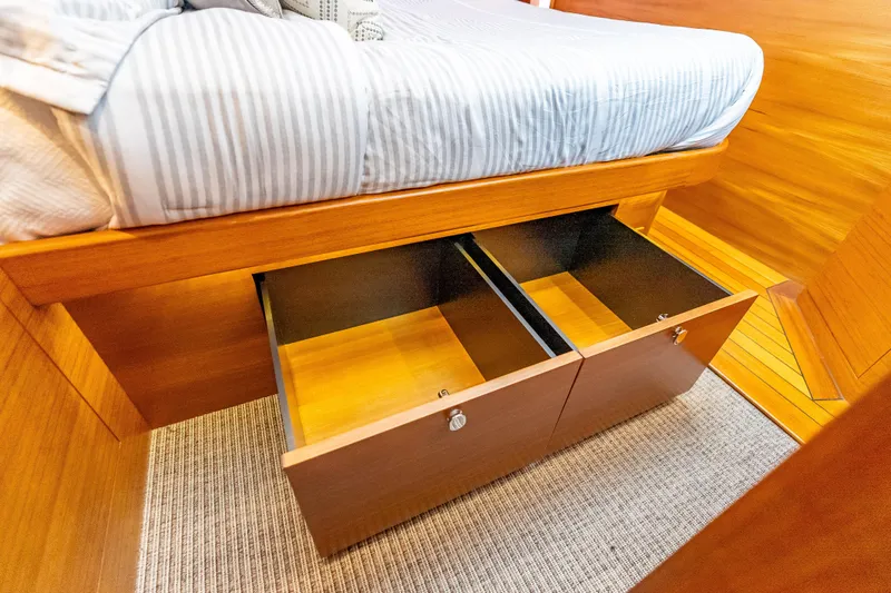 Escape Yacht Photos Pics Under-bed storage drawers in 2022 Grand Banks GB60 Skylounge yacht cabin.