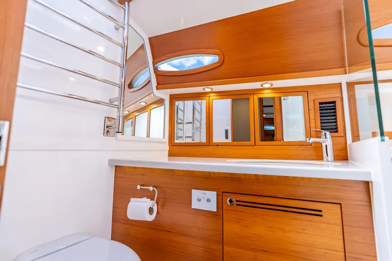 Escape Yacht Photos Pics Luxurious bathroom interior of 2022 Grand Banks GB60 Skylounge yacht.