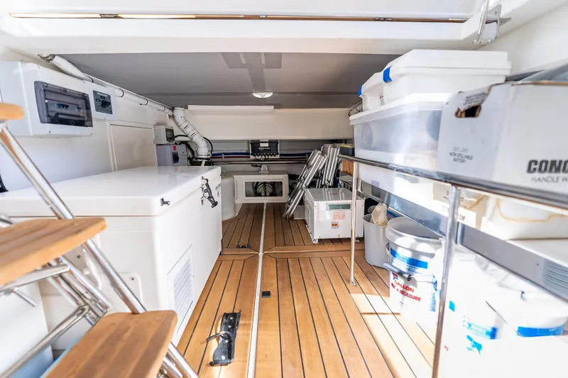 Escape Yacht Photos Pics 2022 Grand Banks GB60 Skylounge interior with wooden flooring and storage compartments.