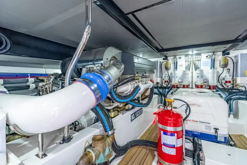 Escape Yacht Photos Pics Engine room of 2022 Grand Banks GB60 Skylounge with advanced machinery and fire safety equipment.