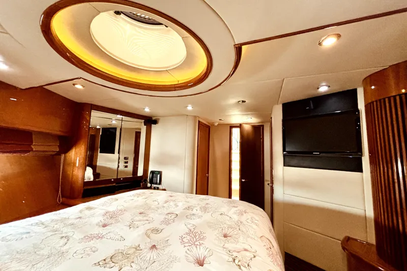  Yacht Photos Pics Luxurious bedroom interior of 2005 Sunseeker 75 Yacht with elegant lighting and modern amenities.