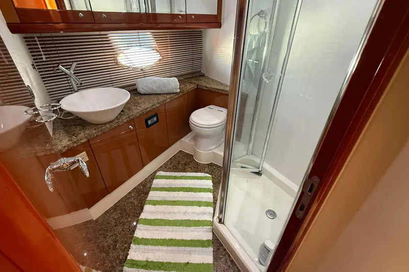  Yacht Photos Pics Luxurious bathroom in 2005 Sunseeker 75 Yacht with modern fixtures and shower.