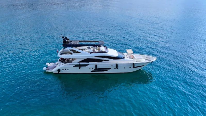 Dolly Yacht Photos Pics Luxury yacht Dominator 800, 2015 model, cruising on clear blue waters.