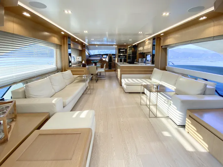 Dolly Yacht Photos Pics Luxurious interior of 2015 Dominator 800 yacht with modern furnishings and panoramic windows.