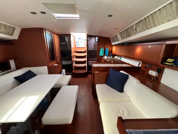 Serendipity Yacht Photos Pics Interior of 2013 Beneteau Oceanis 45 yacht with modern furnishings and wood finish.