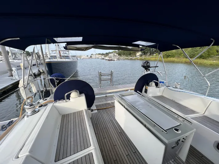 Serendipity Yacht Photos Pics Cockpit view of 2013 Beneteau Oceanis 45 sailboat docked in a marina.