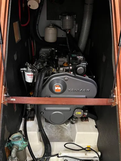 Serendipity Yacht Photos Pics Yanmar engine inside a 2013 Beneteau Oceanis 45 sailboat, showcasing mechanical components.