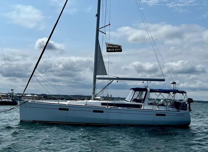 Serendipity Yacht Photos Pics 2013 Beneteau Oceanis 45 sailboat on water under cloudy sky.