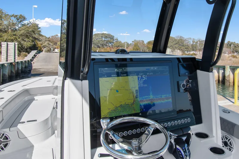  Yacht Photos Pics 2024 Freeman 28 boat dashboard with advanced navigation system and steering wheel.
