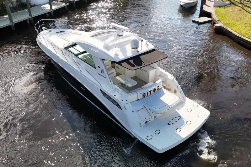  Yacht Photos Pics 2011 Sea Ray 450 Sundancer yacht cruising in a narrow waterway.