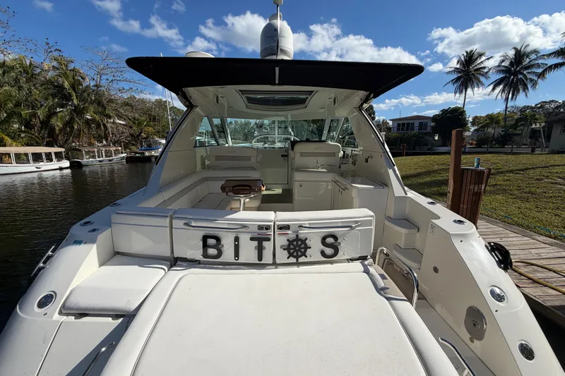  Yacht Photos Pics 2011 Sea Ray 450 Sundancer yacht docked, featuring spacious seating and sleek design.