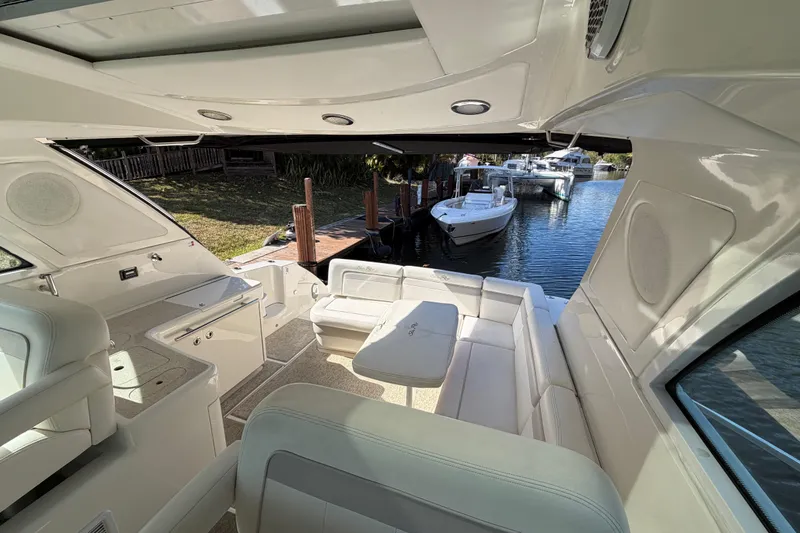  Yacht Photos Pics Luxurious interior of 2011 Sea Ray 450 Sundancer yacht, docked by the water.