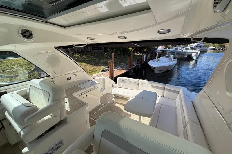  Yacht Photos Pics Luxurious interior of 2011 Sea Ray 450 Sundancer yacht docked by the water.