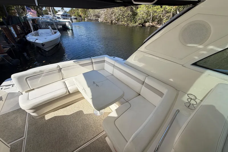  Yacht Photos Pics Luxurious seating area on a 2011 Sea Ray 450 Sundancer yacht by the water.