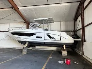  Yacht Photos Pics 2023 Beneteau Flyer 9 SUNdeck boat stored indoors on supports.