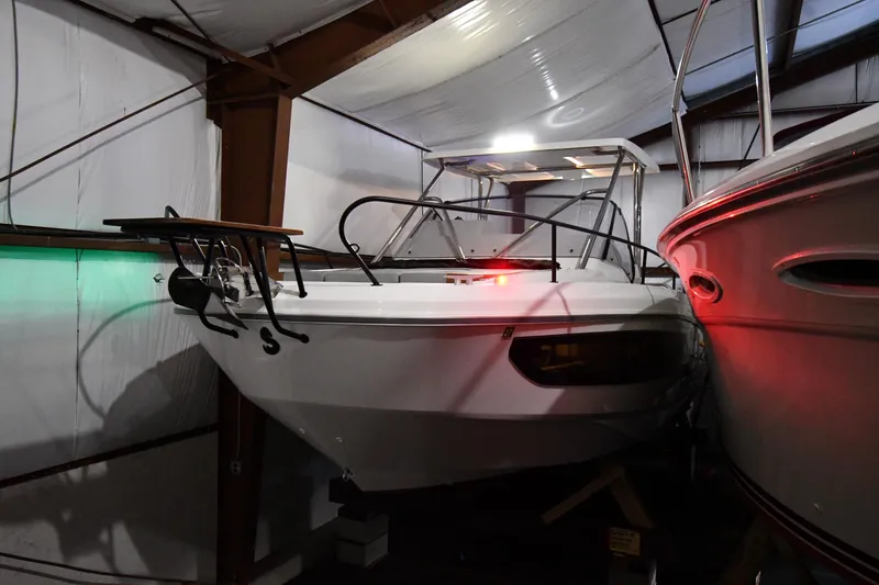  Yacht Photos Pics 2023 Beneteau Flyer 9 SUNdeck boat in storage, indoor lighting.