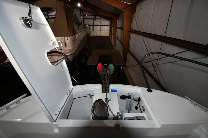  Yacht Photos Pics 2023 Beneteau Flyer 9 SUNdeck boat interior with open storage compartment.