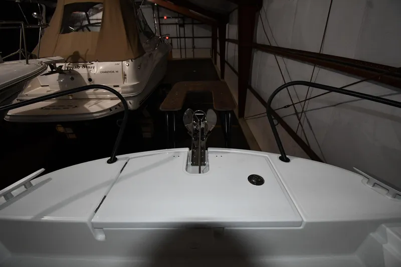  Yacht Photos Pics 2023 Beneteau Flyer 9 SUNdeck in a dimly lit storage area.
