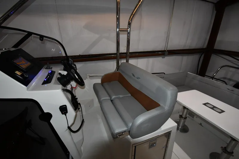  Yacht Photos Pics Interior view of 2023 Beneteau Flyer 9 SUNdeck with helm and seating area.