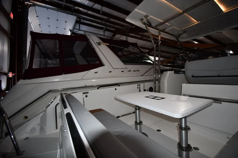  Yacht Photos Pics 2023 Beneteau Flyer 9 SUNdeck interior, featuring sleek seating and a modern table setup.