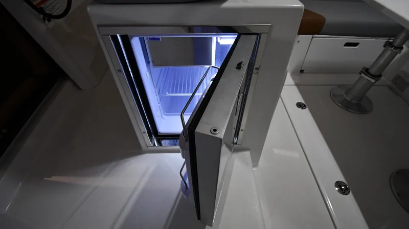  Yacht Photos Pics 2023 Beneteau Flyer 9 SUNdeck interior with open mini fridge.