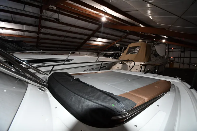  Yacht Photos Pics 2023 Beneteau Flyer 9 SUNdeck in a dimly lit storage facility.