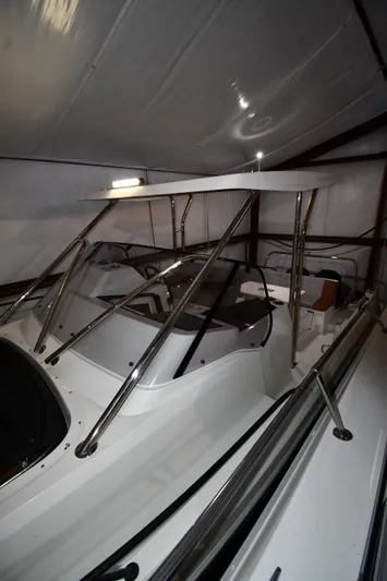  Yacht Photos Pics 2023 Beneteau Flyer 9 SUNdeck boat in storage, showcasing sleek design and modern features.