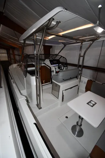  Yacht Photos Pics 2023 Beneteau Flyer 9 SUNdeck interior with modern helm and seating area.