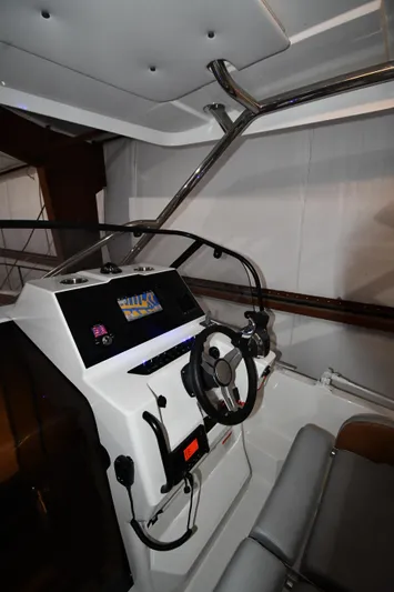  Yacht Photos Pics 2023 Beneteau Flyer 9 SUNdeck cockpit with modern steering and controls.