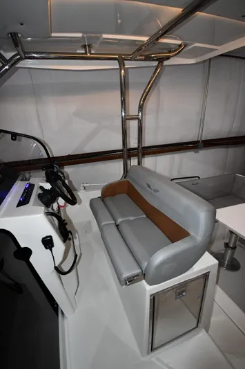  Yacht Photos Pics 2023 Beneteau Flyer 9 SUNdeck interior with sleek seating and modern helm design.