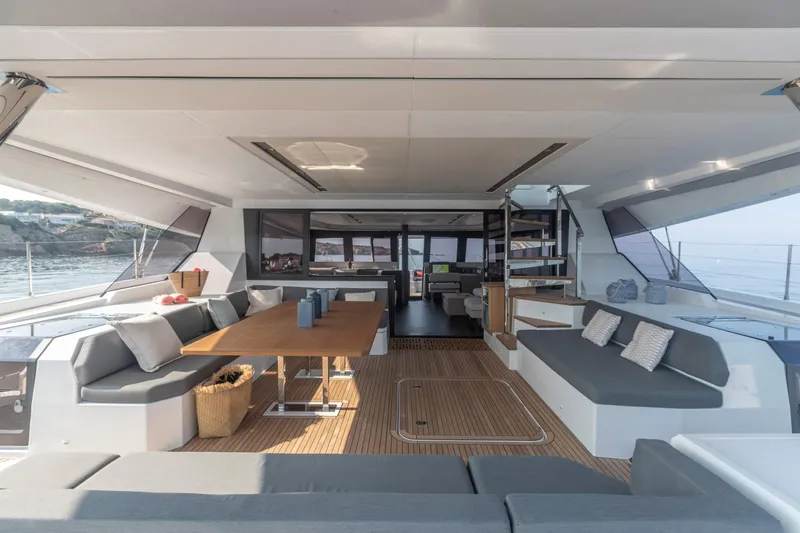  Yacht Photos Pics Luxurious interior of 2025 Fountaine Pajot Samana 59 yacht with spacious seating and elegant design.