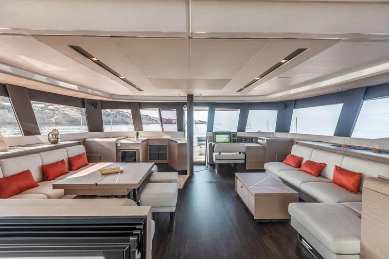  Yacht Photos Pics Luxurious interior of 2025 Fountaine Pajot Samana 59 yacht with modern furnishings and panoramic windows.