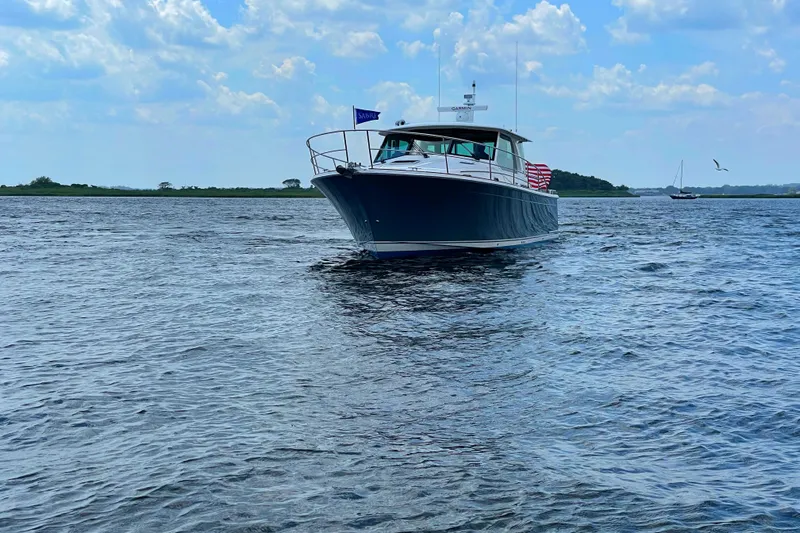  Yacht Photos Pics 2023 Sabre 43 Salon Express cruising on a sunny day with blue skies.