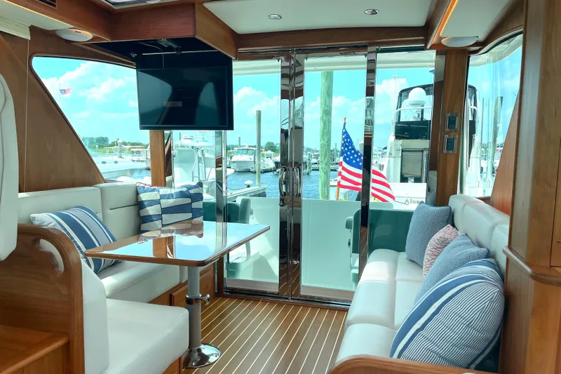  Yacht Photos Pics Luxurious interior of 2023 Sabre 43 Salon Express yacht with plush seating and elegant decor.
