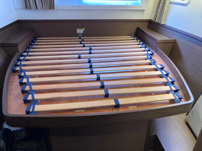 Vela Yacht Photos Pics Interior of 2018 Lagoon 42 catamaran with wooden bed slats and modern design.