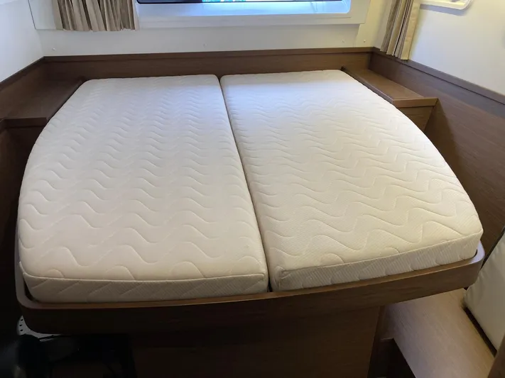 Vela Yacht Photos Pics Double bed in 2018 Lagoon 42 yacht cabin with white mattresses.