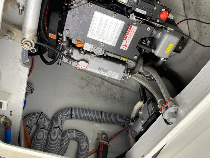 Vela Yacht Photos Pics Engine compartment of a 2018 Lagoon 42 catamaran, showcasing mechanical components and wiring.