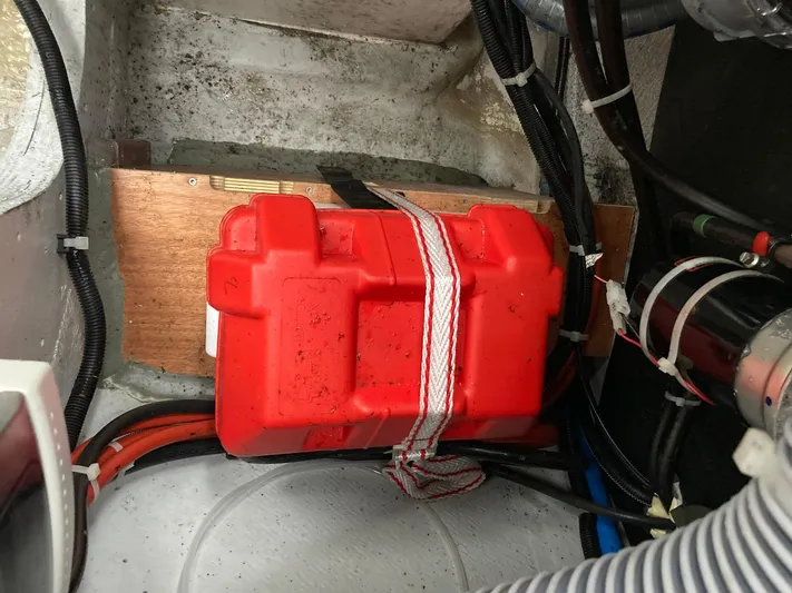 Vela Yacht Photos Pics Red battery box secured in a 2018 Lagoon 42 boat's engine compartment.