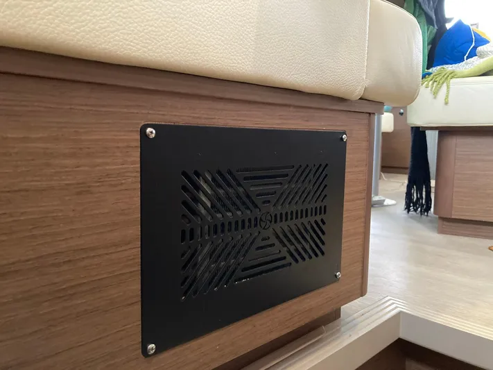 Vela Yacht Photos Pics Ventilation panel on a 2018 Lagoon 42 yacht's wooden interior seating area.